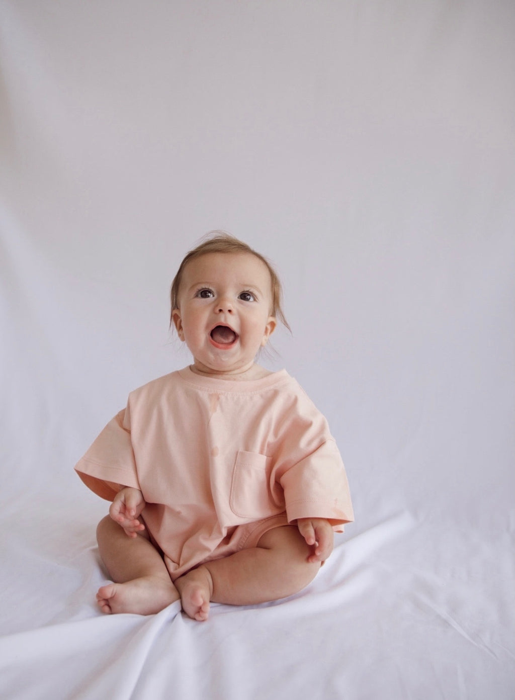 Cory Pocket Romper in Peach Powder
